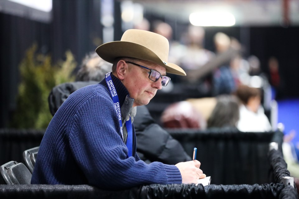 Okotoks artist Paul Rasporich sketches scenes rink-side during the 2020 Alberta Scotties at Murray Arena in Okotoks on Jan. 23. (Brent Calver/Western Wheel)