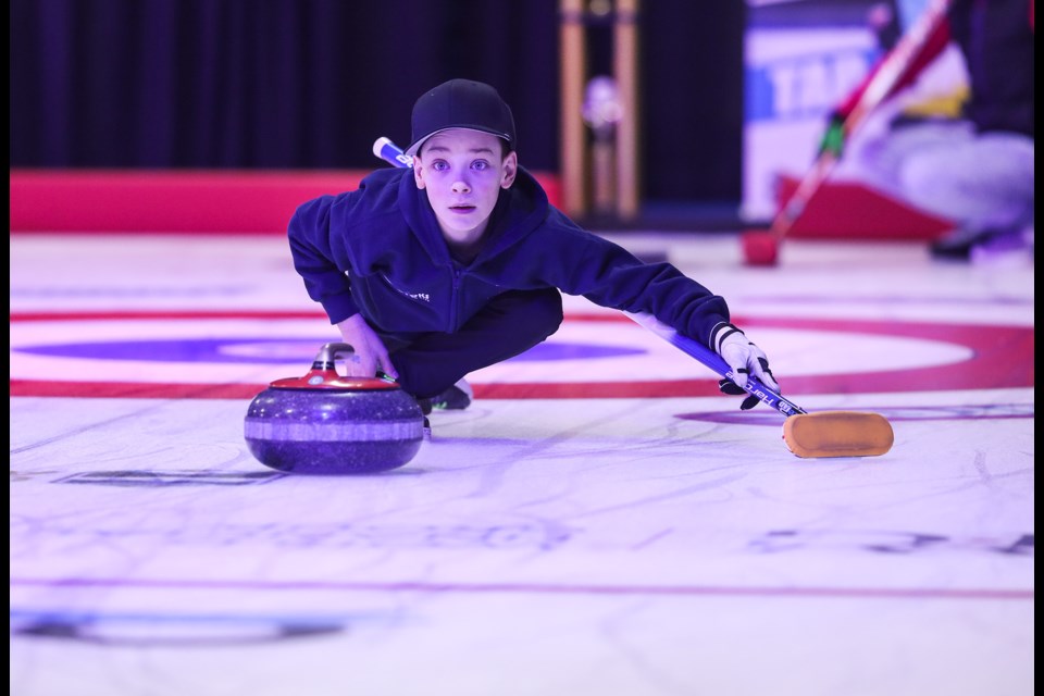 Kesler Bachek throws in the Alberta Hit-Draw-Tap championship before the final at the 2020 Alberta Scotties at Murray Arena on Jan. 26. (Brent Calver/Western Wheel)