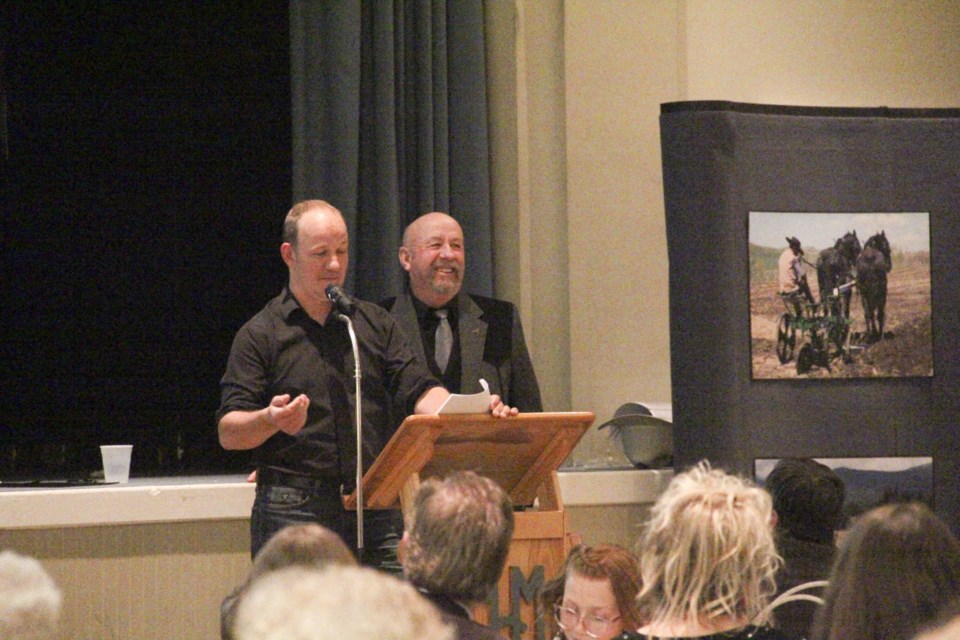 Donny Broomfield delivers the ranching family's history alongside his father, Doug Broomfield, at the Stockmen's Dinner fundraiser hosted by the Friend of the Bar U Ranch at Highwood Memorial Centre in High River on Jan. 25.