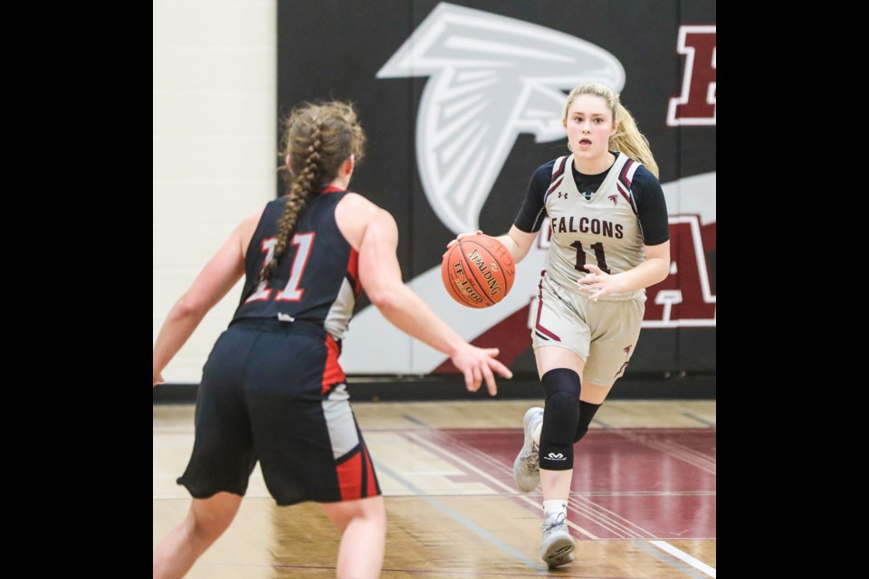Foothills Falcon Chloe Hunter brings the ball up court against the Mt. Baker Wild. The Falcons beat the Chestermere Lakers last night at will play the Holy Trinity Academy Knights in the 4A South Central zone final March 12 at 5:30 p.m. at HTA. (Brent Calver/Western Wheel)
