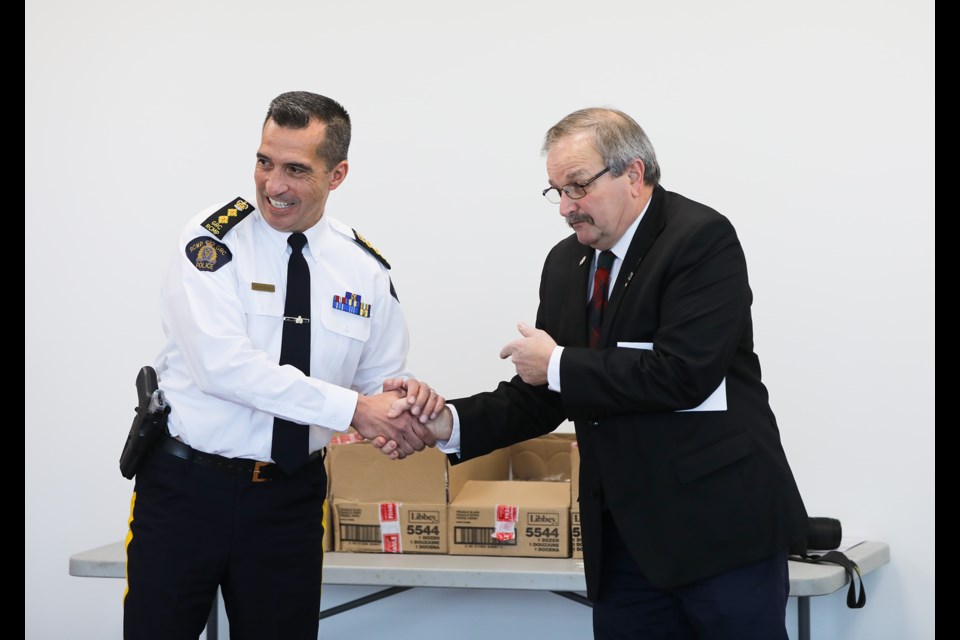 Okotoks Mayor Bill Robertson introduces RCMP Chief Superintendent Trevor Daroux during RCMP Appreciation Day at the Okotoks Emergency Services Building on Feb. 1. (Brent Calver/Western Wheel)
