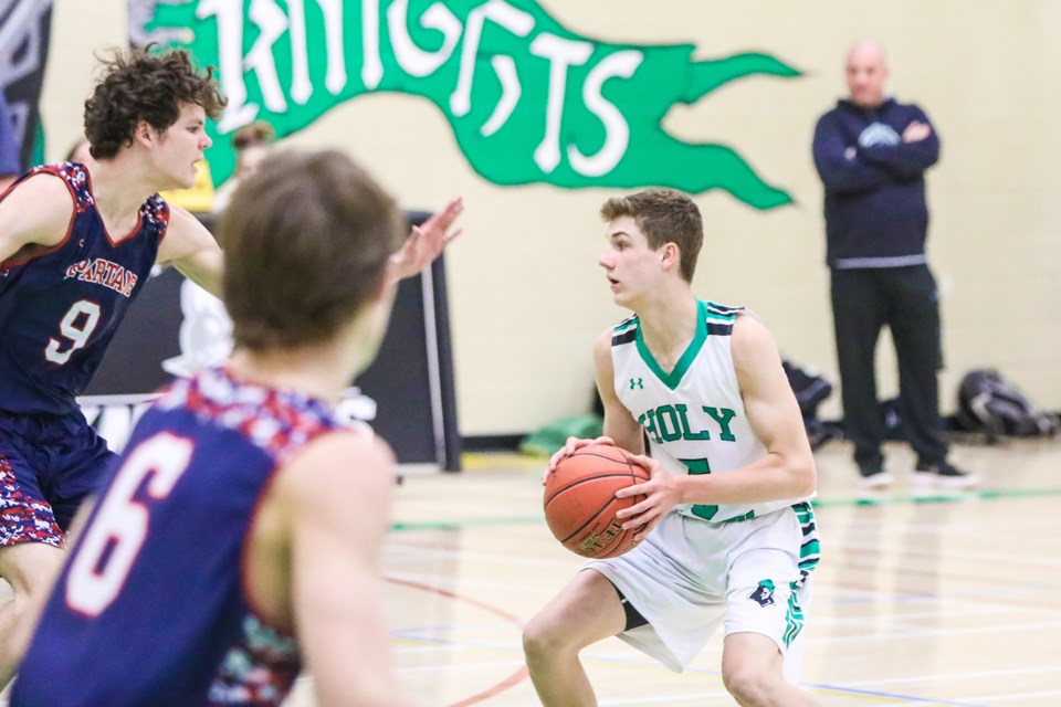 HTA Knights guard Riley Thorn has the buzzer-beater three-point shot in the 83-80 win over the Strathmore Spartans on Feb. 26. (Brent Calver/Western Wheel)