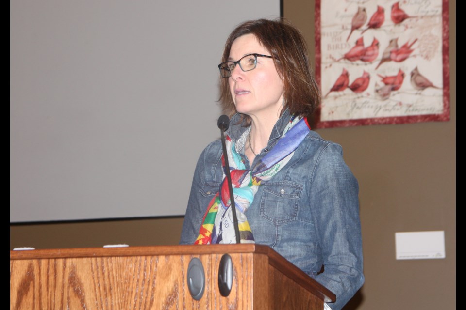 Okotoks Councillor Tanya Thorn talks of the continuing struggles for women at the International Women's Day celebration on March 6 at the Okotoks United Church. (Bruce Campbell, Western Wheel)