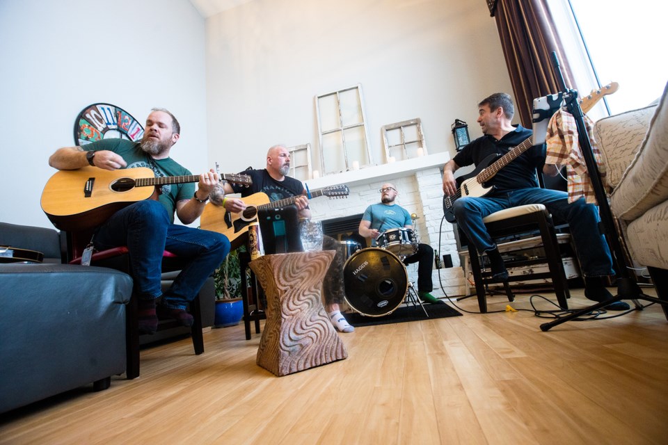 Okotoks band Haggis performs to a socially-distanced crowd via livestreaming at a band member's home for St. Patrick's Day on March 17. Originally slated to play at the George Public House, the band chose to hold an "online kitchen party" and play to those who are also staying at home.