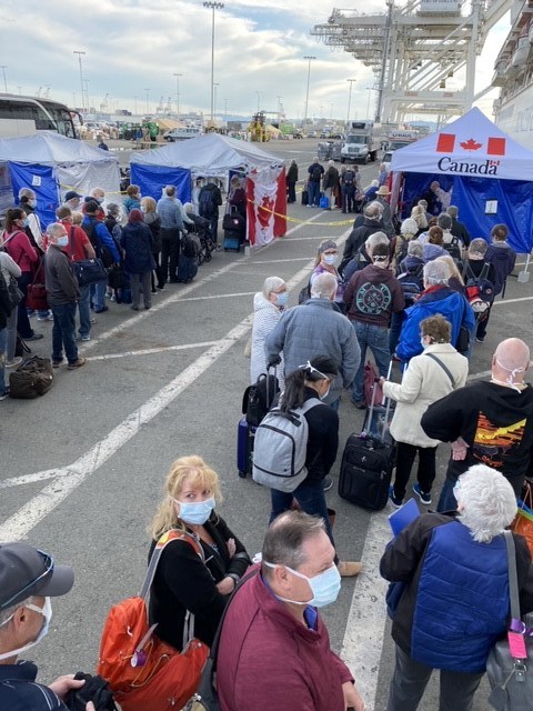 Canadians wait in line for health checks and repatriation after travelling on the Grand Princess cruise ship. (photo submitted)