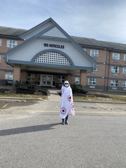 Barb Goettler dons her Red Cross blanket as a jacket on a chilly winter morning during one of the Goettlers' three daily walks while at CFB Trenton. (photo submitted)