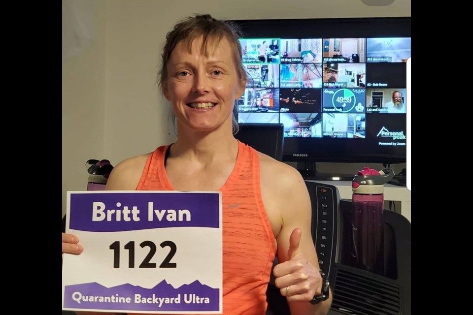 Britt Ivan celebrates running 100km in the Quarantine Backyard Ultra on April 4. She will be running in Okotoks for the second virtual backyard run on July 11. (Photo submitted)