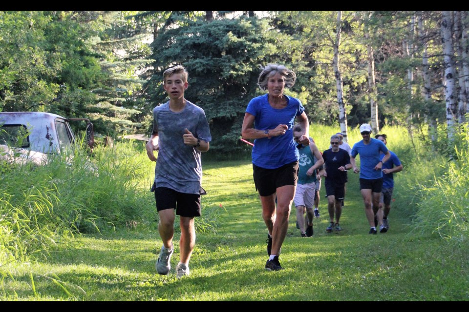 Alexander Stratmoen and mom Jennifer Hittel, a Red Deer Lake School teacher, run in the Betty's Backyard Ultra on July 11 in DeWinton.  (Photo courtesy of Kristy Wilson)