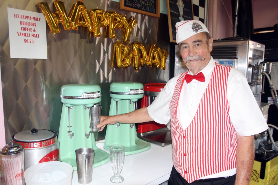 Marv Garriott stirs up a classic 1950s-style chocolate milkshake on July 26 in Black Diamond. Marv's Classic Soda Shop celebrated 20 years of being in the community on the weekend. (Bruce Campbell, Western Wheel)