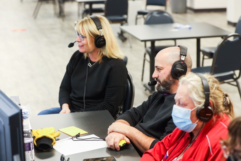 Shannon Kleibrink and Mike Libbus deliver commentary during a livestream of the finals for the WFG Okotoks Mixed Doubles Classic at the Okotoks Curling Club on Nov. 1. (Brent Calver/Western Wheel)