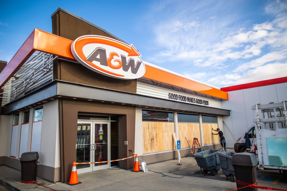 Police arrested a man from Okotoks after he allegedly smashed the storefront windows of the A&W restaurant at Aldersyde on the morning of Nov. 4. (Brent Calver/Western Wheel)