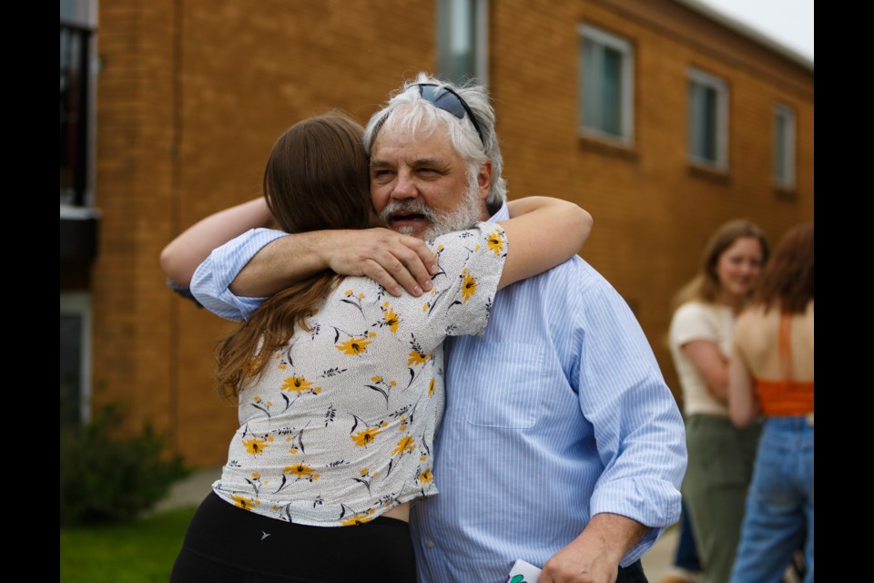 Martin Kennedy engages with friends, family and students that participated in the drive-by retirement parade on Saturday, June 6. Kennedy is retiring after teaching band at Holy Trinity Academy for 39 years. (Photo by Devon Langille )