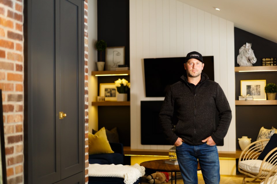 Scott Lawrie, owner of Creek Stone Fine Homes, poses at a client's home that is under renovation in Okotoks on Oct. 21. (Photo by Devon Langille Photography)