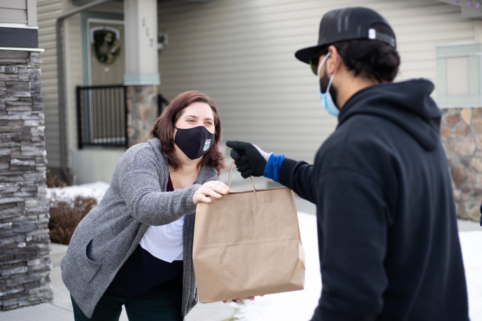 The Calgary Health Foundation is distributing thousands of free meals from Sunterra Market to health-care workers in the region, including Airdrie, Cochrane and Okotoks (pictured), as part of the Feed the Frontline campaign.