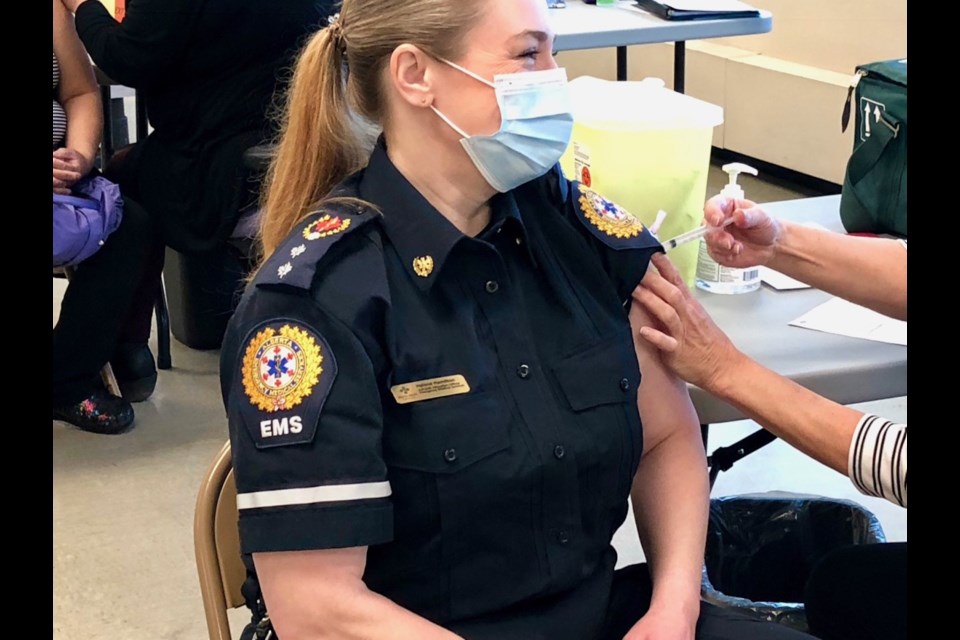 Helene Hamilton, a primary-care paramedic in Okotoks,  received her COVID-19 shot on Jan. 17 in Calgary. (photo submitted) 