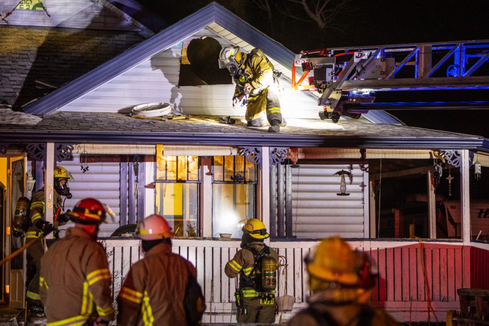 Fire crews from Turner Valley and Black Diamond work to extinguish a fire in the Turner Valley home of music venue Mikey's on 12th owner Mike Clark on the evening of Jan. 17.   |  Brent Calver/Western Wheel