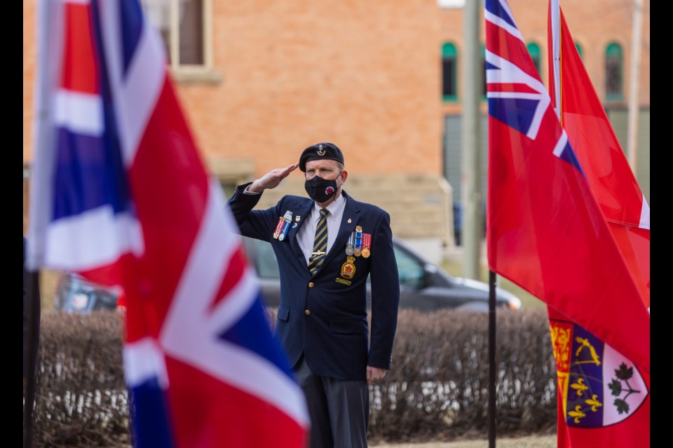 Veteran Barry Leslie salutes as Okotoks Legion Branch 291 members gathered at the cenotaph on April 11 to commemorate Birth of a Nation Day, celebrating Canada's victory at Vimy Ridge in the First World War.