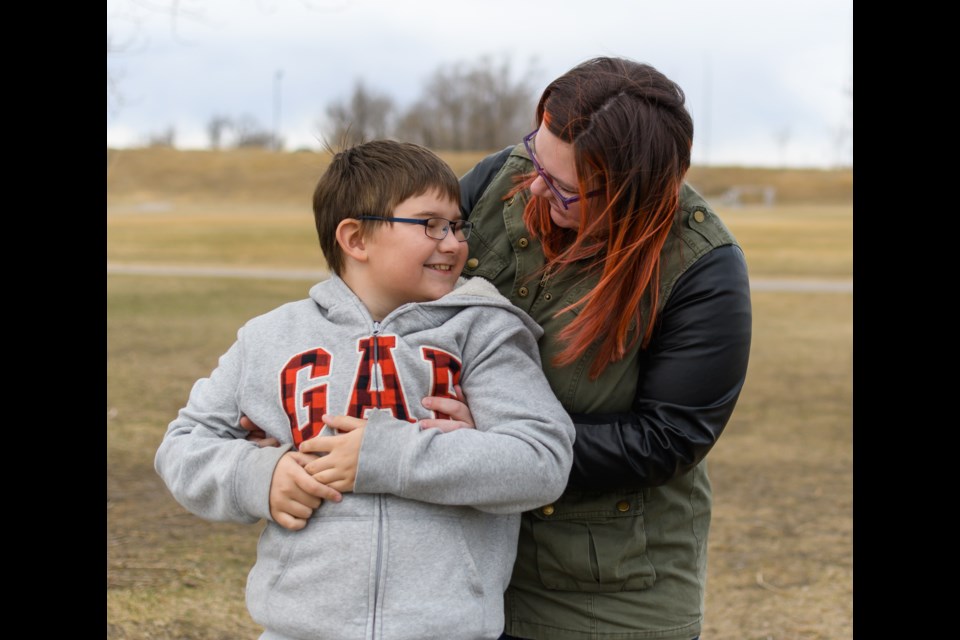 Danielle Slamko spends time with her eight-year-old autistic son Liam at Riverside Inclusive Park on April 10. April is World Autism Month. 