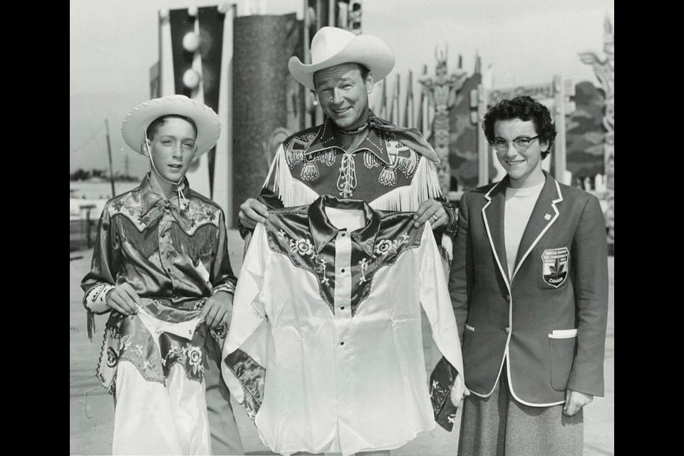 Annabelle Murray McLean of Okotoks presents a shirt to Roy Rogers at the CNE in Toronto in 1954. She is wearing the jacket she earned as a member of Canada's track and field team at the 1954 Empire Games in Vancouver. (Photo submitted) 