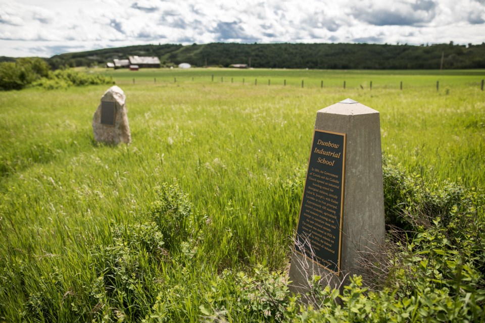 Two memorial plaques serve as some of the only remaining signs of the Dunbow Industrial School (also known as St. Joseph's Industrial School) north of Okotoks which operated from 1884 to 1922. (Brent Calver/Western Wheel File Photo)