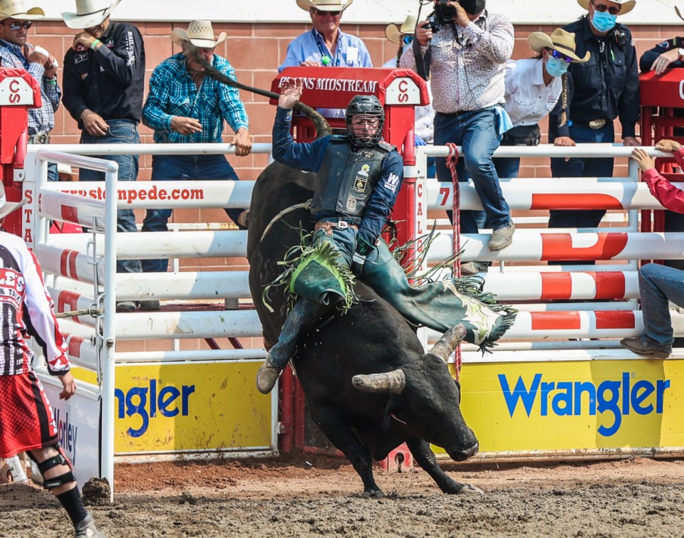 Comp grad claims his first Stampede bull riding title - Okotoks ...