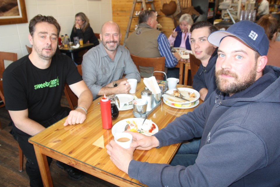 Sweetgrass Eatery and Deli owner Roland Griesser joins the Bold Electric crew for breakfast. From left bottom, clockwise, Griesser, Brent Ballash, Cole Chapman and Nick Timons. (Bruce Campbell/Western Wheel)