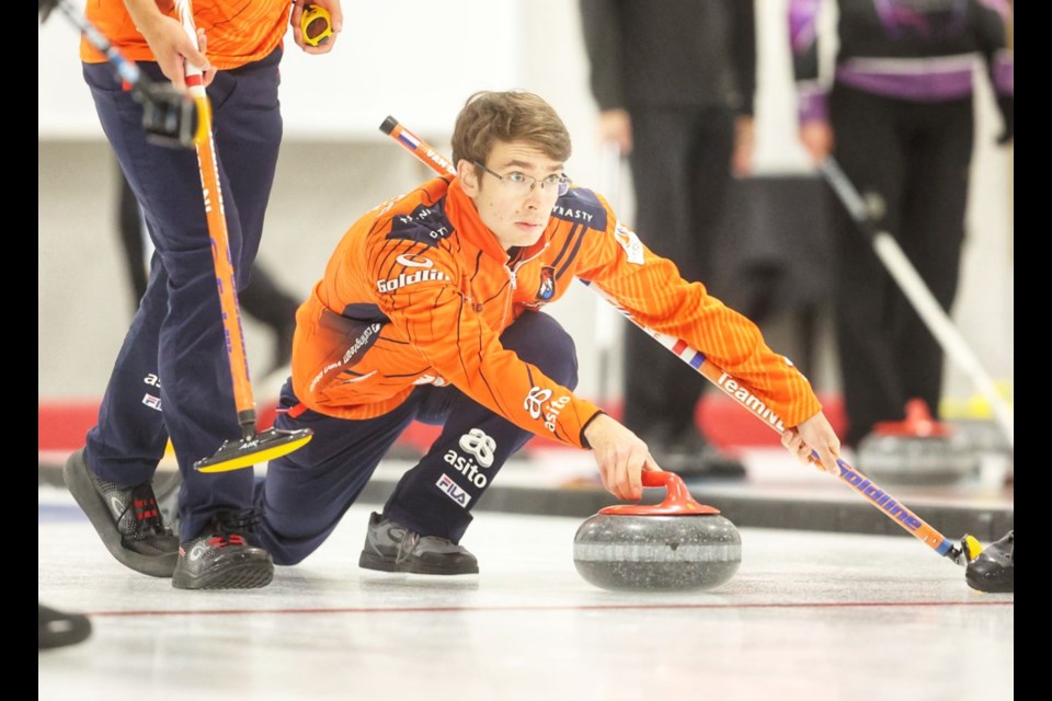 Jaap van Dorp, skip for the Dutch Men's National Curling Team comes out of the hack against Kevin Koe at the ATB Classic Men's Alberta Tour at the Okotoks Curling Club on Sept. 24.
