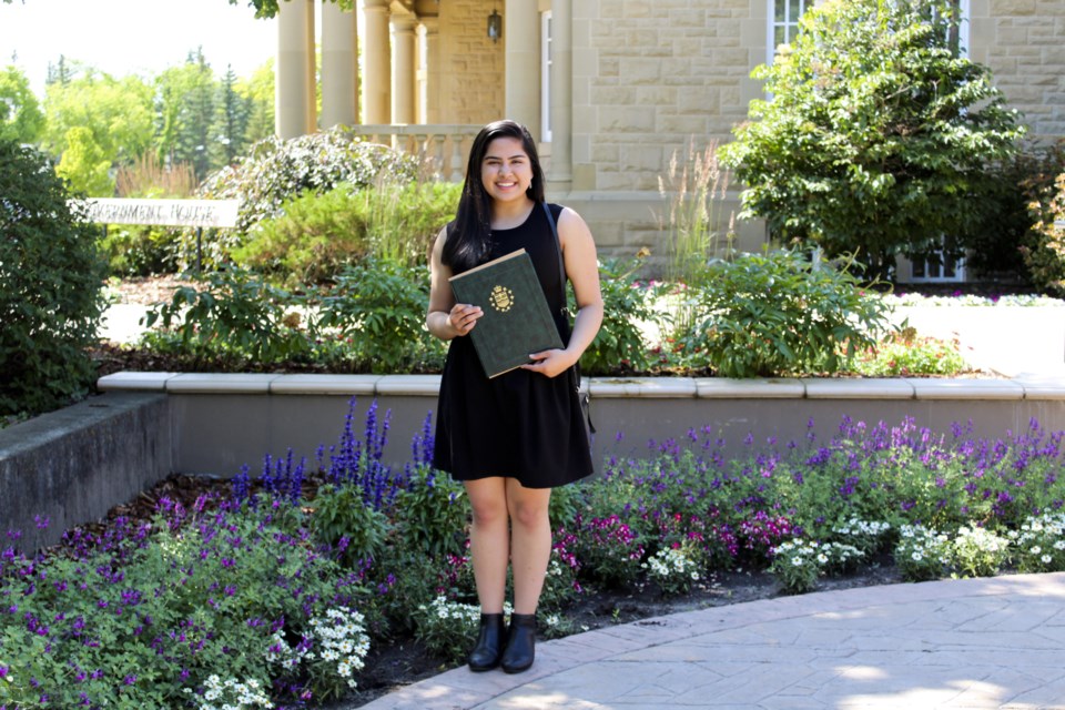 Arzina Jaffer standing with her Queen's Golden Jubilee Citizenship Award outside of the Government House in Edmonton on July 23. (Photo submitted)