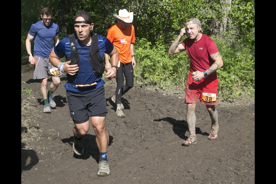 Bruce Campbell/Western Wheel
Kevin Barata leads the way as the 25th lap of the 6.7km loop at the Outrun Rare Backyard Ultra gets started on June 22 near the Millarville Racetrack.