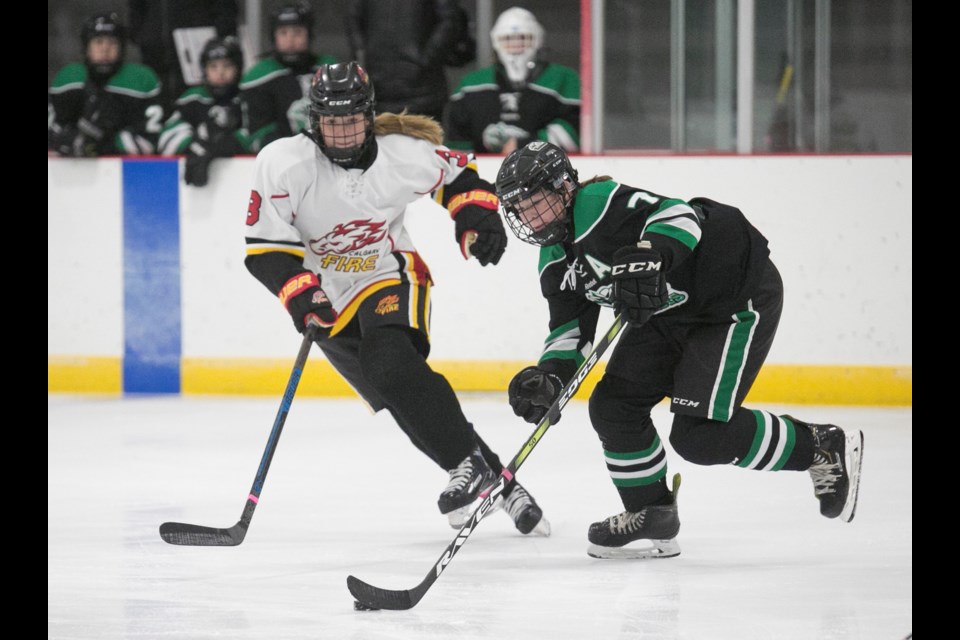 Rocky Mountain Raiders forward Anika Peters skates the puck up ice versus the Calgary Fire in the AFHL Bantam Elite team's home opener, a 3-2 shootout loss on Oct. 20 at the Scott Seaman Sports Rink.
(Remy Greer/Western Wheel)
