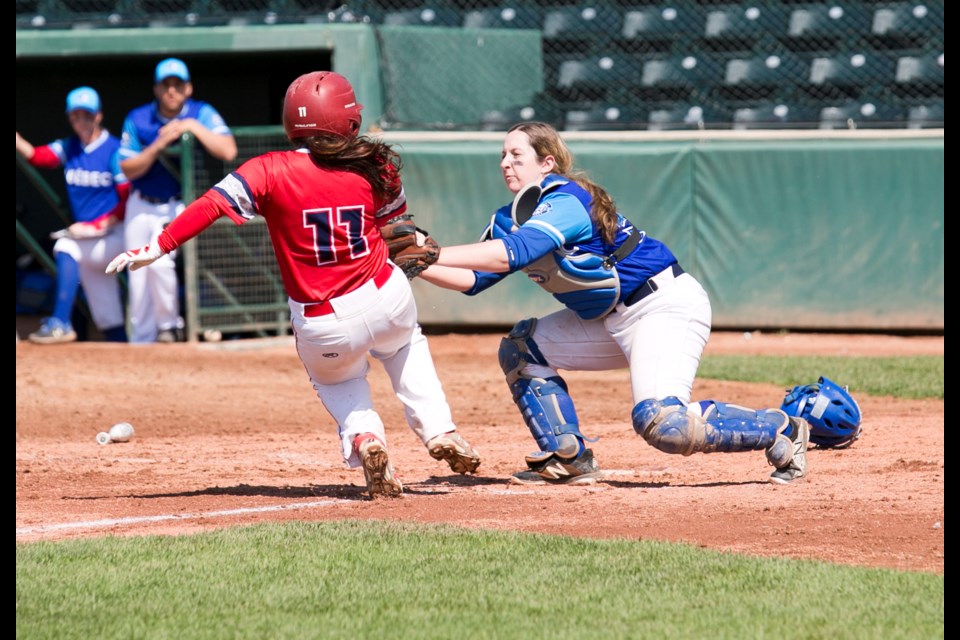 Quebec catcher Bridget Kelly gets down the tag on Ontario's Marylena Florio in the gold medal game, July 8 at Seaman Stadium. (Remy Greer/ Western Wheel)