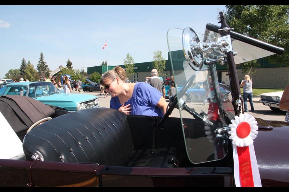Corrine Davidson of Black Diamond checks out a 1926 Ford Model T at last year's Black Diamond Car Show. This year's event takes palce on July 28.
(Wheel File Photo)