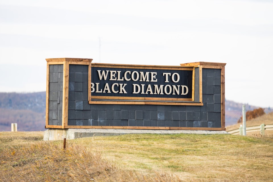 A Black Diamond welcome sign along Highway 7 is one among the signs pre-dating amalgamation that the Town of Diamond Valley is looking to replace. (BRENT CALVER/Western Wheel)