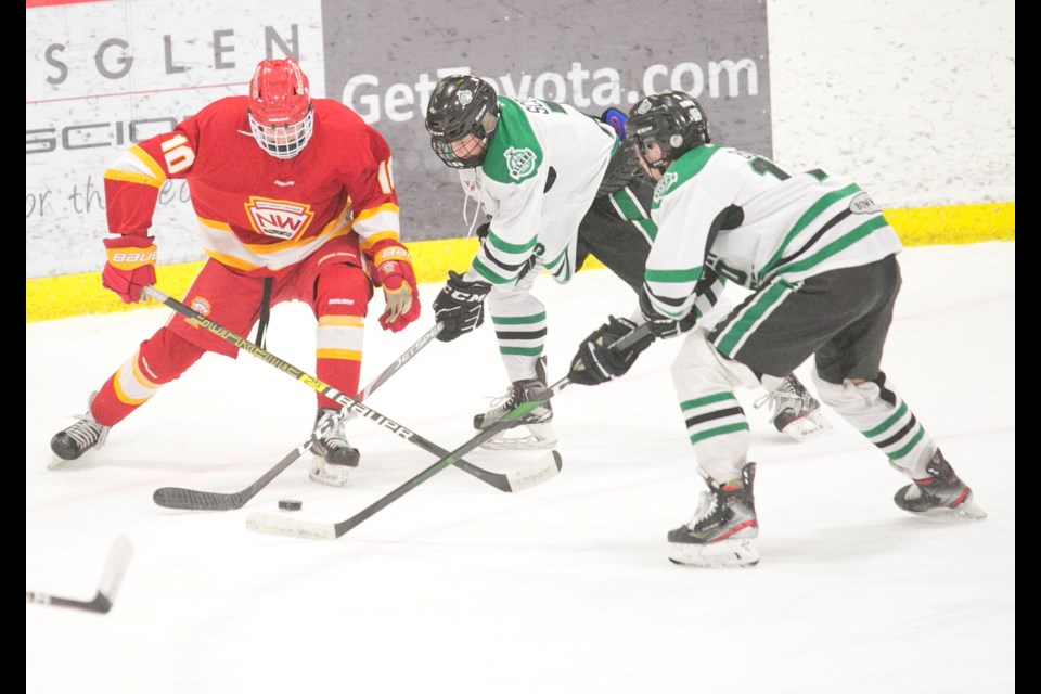 Okotoks Bow Mark Oilers Caden Scott and Daxton Budd defend during the 3-3 tie with the Calgary Flames in AMHL action on Dec. 15 at Father David Bauer Arena.(Remy Greer/Western Wheel)