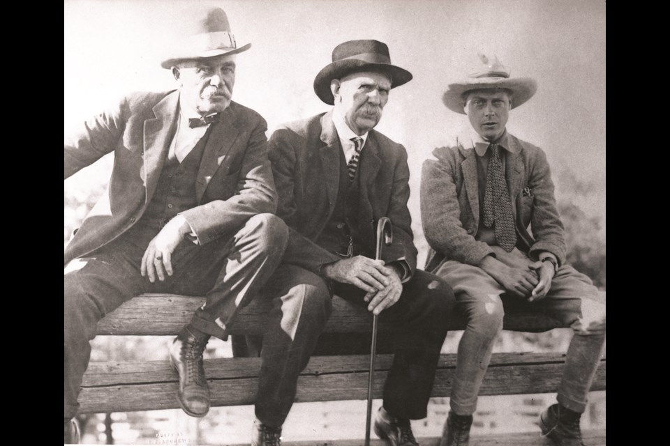 Edward, Prince of Wales, sitting on a corral fence with Archie McLean and George Lane at the Bar U Ranch in 1919. (Photo courtesy of the Museum of the Highwood)