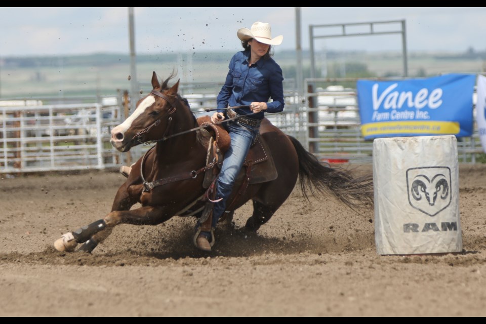 Millarville barrel racer Jenna O'Reilly turns the first barrel on June 23 at the Guy Weadick Days Rodeo in High River. (Photo by Remy Greer/Western Wheel)