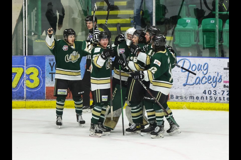 The Okotoks Oilers celebrate the 3-2 win over the Brooks Bandits at the final buzzer in Game 4 of the AJHL South semifinal series on March 29 in Okotoks. 