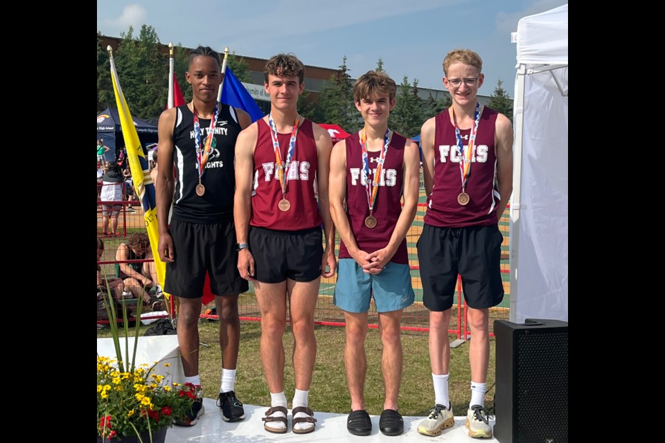 The South Central Zone 4x400m open relay team featuring HTA Knight Akron Spatz, Foothills Falcons Josh Heuver, Nathan Heuver and MacKendrick Weber pose after winning bronze at the ASAA Provincial Track & Field Championships at Edmonton’s Foote Field on June 2. 