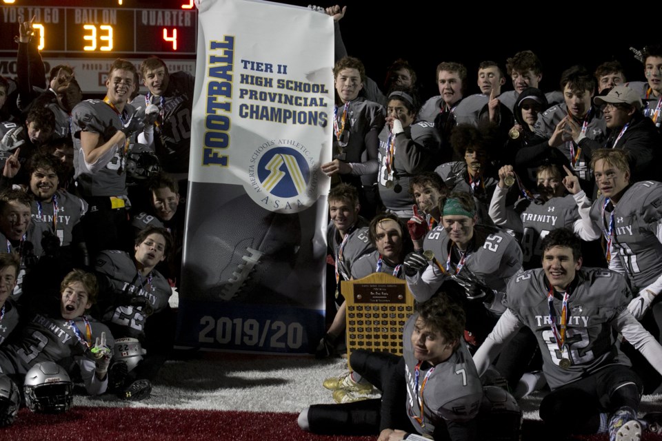The Holy Trinity Academy Knights celebrate their first provincial high school football championship after downing the Austin O'Brien Crusaders 35-3 on Nov. 22 in Raymond. (Bruce Campbell, Western Wheel)
