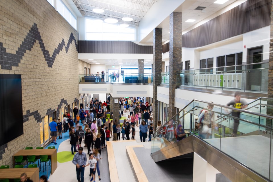 The open house for the newly finished Meadow Ridge School on Aug. 29. The main hallway  represents a river valley while the upper portion has a 'lookout' to provide more space for students and enhance teacher supervision. (BRENT Calver/Western Wheel)