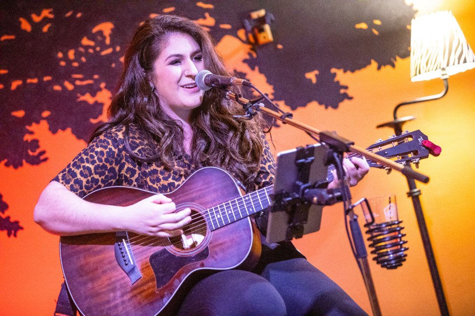 Okotoks singer/songwriter Michela Sheedy, performing here at Tribal Connection Market, said a dozen of her shows have been cancelled in light of COVID-19. (Wheel File Photo)