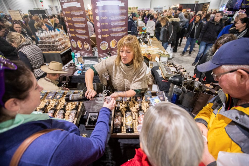 Denise Chartrand of Spirit Hills Honey Winery serves up samples of the winery's honey sugared wine at the 2018 Millarville Christmas Market.