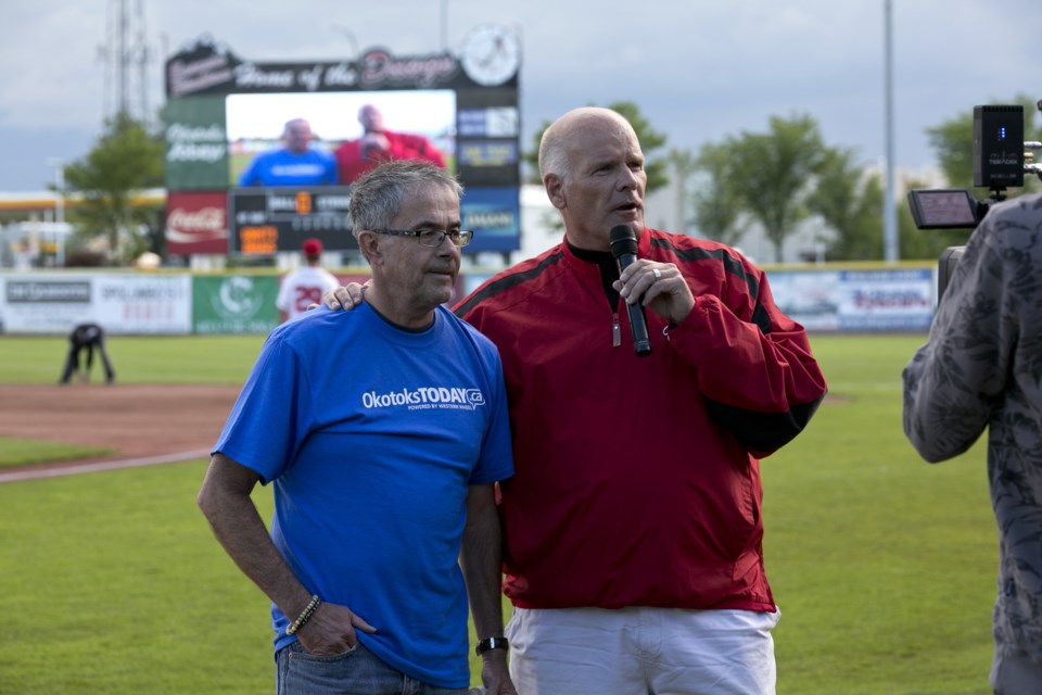 Editor Bruce Campbell is introduced before throwing the first pitch at the June 25 Dawgs game.