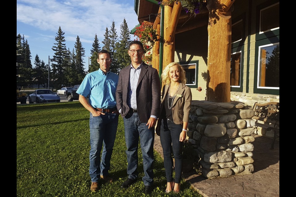 Foothills MP John Barlow, Alberta Minister of Justice and Solicitor General Doug Schweitzer, and Banff-Kananaskis MLA Miranda Rosin stand in front of the Bragg Creek Community Centre at the first stop of the four-week Rural Crime Tour on Sept. 5. (Megan Thrall/Western Wheel)