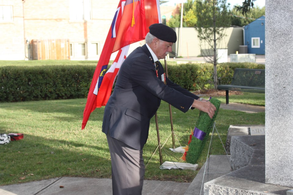 Bob McLeod of the Okotoks Royal Canadian Legion lays a wreath on Sept. 15 at the cenotaph in memory of those Canadians who died for their country during significant battles in Septembers. Sept. 15 is Battle of Britain Day. 