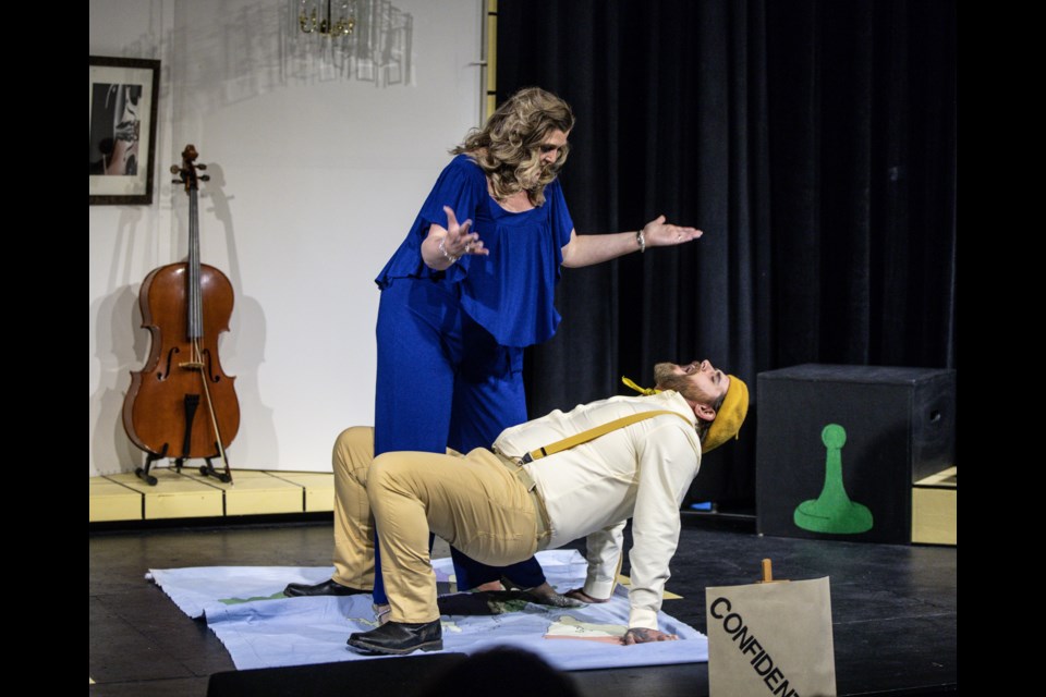 Mrs. Peacock (played by Kelly Misko) tries to help an infirmed Colonel Mustard (played by Jared McCollum) in the Dewdney Players performance of Clue at the Rotary Performing Arts Centre on Feb. 20. (Brent Calver/Western Wheel)