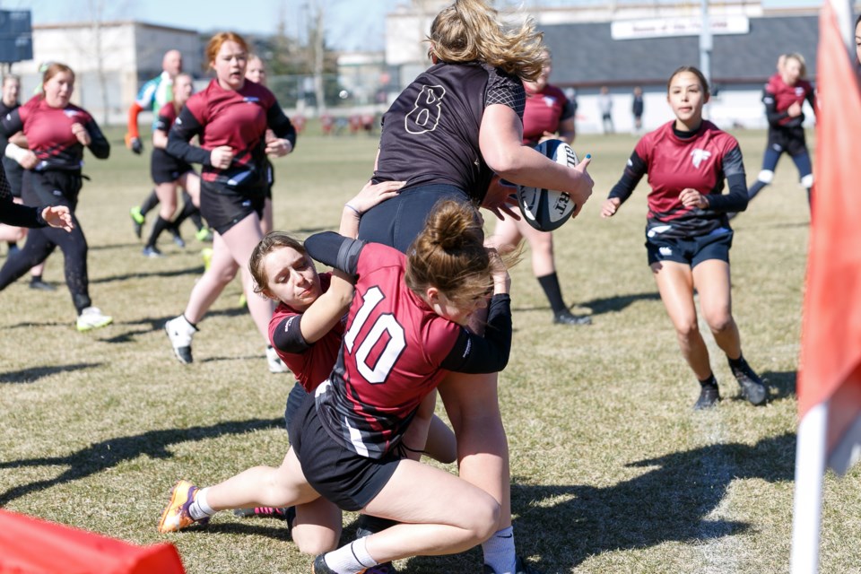 Foothills Falcons Eve Shepherd and Anna Murray combine for a tackle versus Chinook during the Spring Bash tournament on April 20. 
