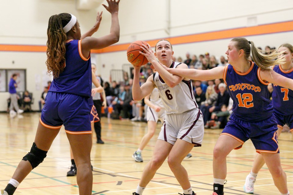 Foothills Falcon Savanah Sommerfeldt drives to the basket during the 61-35 victory over W.H. Croxford Cavaliers in the 4A South Central Zone final on March 9 in Airdrie.
