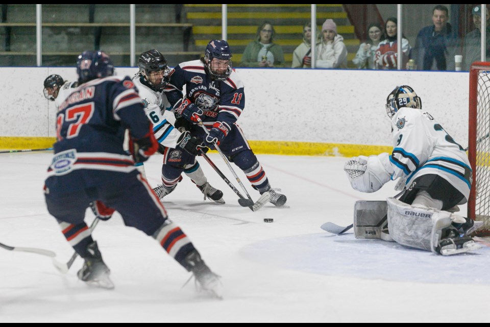 Carstar Okotoks Bisons forward Scott Brown takes the puck to the net versus the Sylvan Lake Wranglers during the HJHL Final. Okotoks won the best-of-seven series in six games, taking Game 6 by a 1-0 score on the road on March 30. 