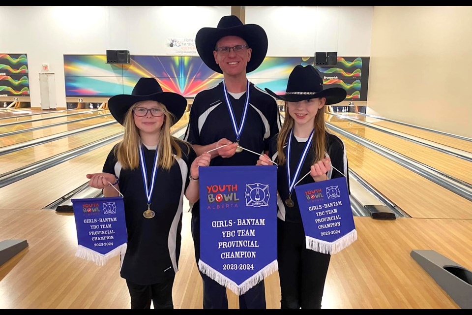 The Millennium Lanes youth bowling team featuring, from left, Elyssa de Boer, coach Kyle Honish and Elizabeth Honish won the Youth Bowl Alberta Fivepin Bantam Girls Doubles provincial championship. (Photo submitted)